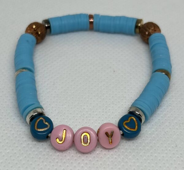 Clay beads with "Joy"