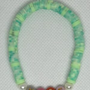 mixed green clay beads with 2 pearl accents on each side of the word. The word posted is (NICE). word, Name or size: click here to specialorder