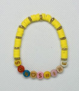 Yellow and Gold color Beads with. colorful letters. this one says Sun Shine 