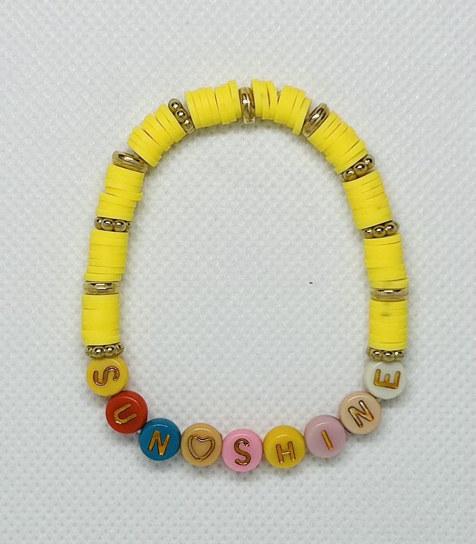 Yellow and Gold color Beads with. colorful letters. this one says Sun Shine