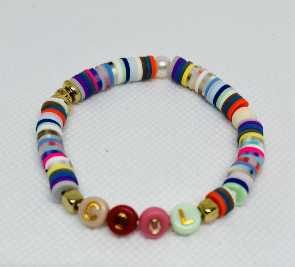 Multi color Clay Beads with Multi color Letter beads shown with the word, COOL