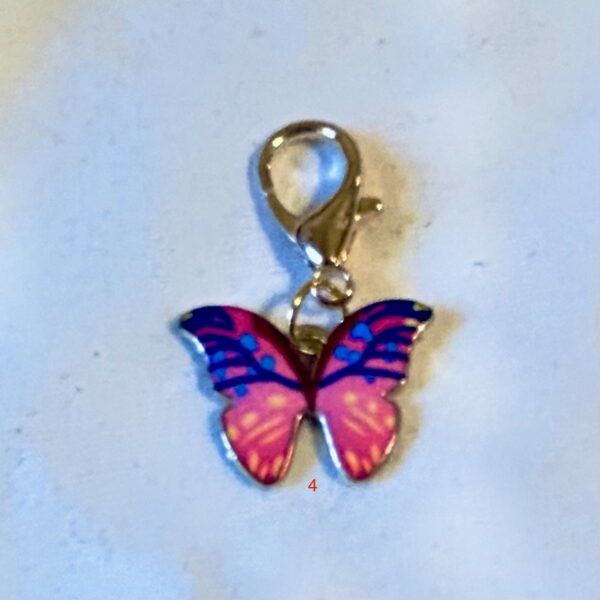 Butterfly light pink attached to a large Lobster claw